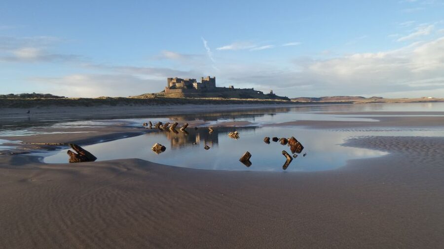 Alnwick Castle and Scottish Borders Tour from Edinburgh - Bamburgh beach and its dramatic castle