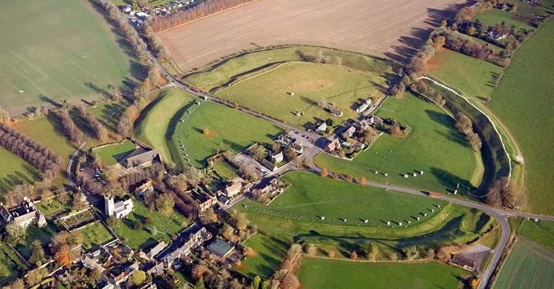 From London: Stonehenge & The Stone Circles of Avebury Tour - Walking through medieval Avebury’s giant stone circle