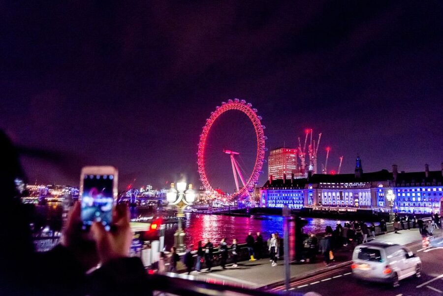 London: Nighttime Open-Top Bus Sightseeing Tour - Live guides, audio languages, and the feel of the ride