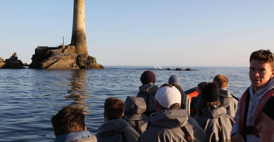 Rounding Cornwall Boat Trip Experience. (Departing Hayle) - Longships Lighthouse and the Minack Theatre from offshore