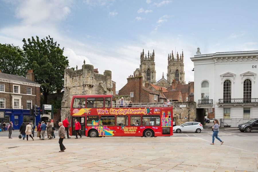 York: City Sightseeing Hop-On Hop-Off Bus Tour - Exhibition Square begins the circuit